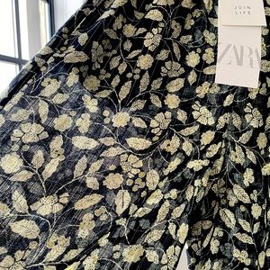 Zara NWT palazzo pants with floral motif.